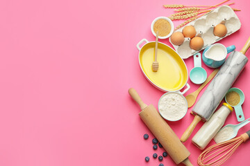 Ingredients for preparing bakery and kitchen utensils on color background