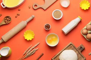 Fototapeta na wymiar Ingredients for preparing bakery and kitchen utensils on color background