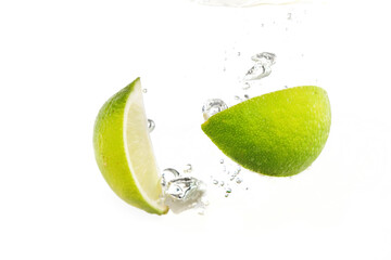 lime and lemon splashing water isolated on white background - 448935812