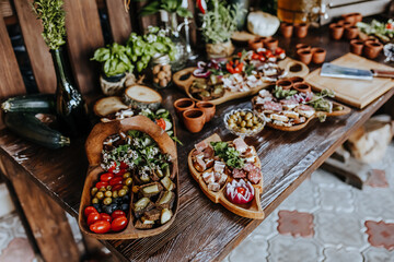 Beautifully decorated snacks on the banquet table before the holiday. Catering food and drink on wedding party