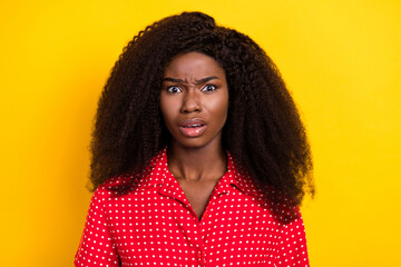 Photo of unhappy displeased young dark skin woman bad mood face person isolated on yellow color...