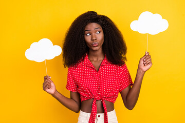Photo of nice optimistic brown hair lady hold cloud wear shirt isolated on yellow color background