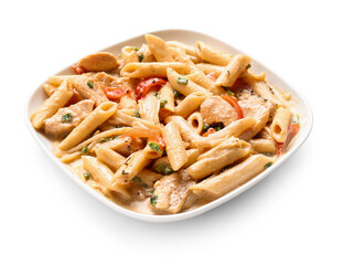 Plate with tasty cajun chicken pasta on white background