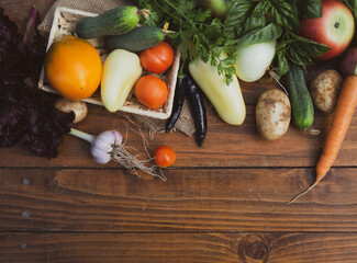 Vegetables on a wooden table. Bio Healthy food, herbs and vegetables from farm plantations.