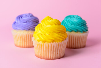 Tasty Birthday cupcakes on color background, closeup