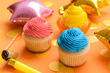 Composition with tasty Birthday cupcakes, balloons and candles on color background, closeup