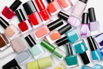 Obraz premium Different nail polishes on white background