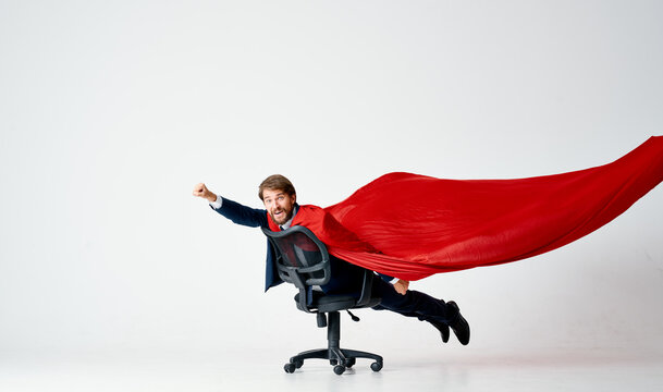 business man in red cloak superman manager office