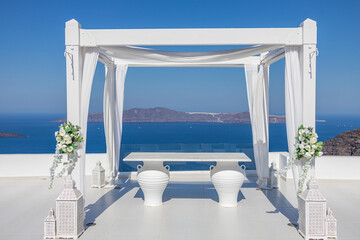 Wedding decoration on Santorini Island, a popular wedding destination in Greece. Elegant wedding...