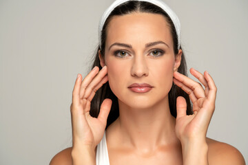 portrait of a young beautiful woman with makeup and headband