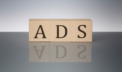 ADS concept, wooden word block on the grey background