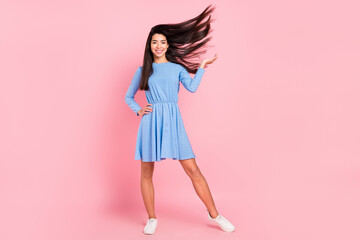 Full length photo of young attractive girl happy positive smile fly air volume hair isolated over pink color background