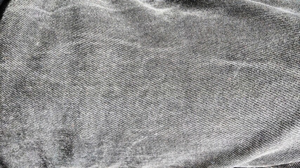 stone washed jeans. Denim fabric texture on black and white. Copy space