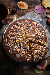 Autumn homemade hazelnut pie on wooden background, mannik pie, top view, selective focus