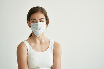 woman in medical mask health problems infection light background