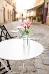 Empty cafe terrace with white table and chair. interior Street cafe.