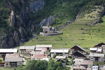 Fototapeta na wymiar village, on high church and cemetery in the mountains in the french alps
