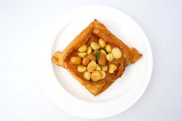 Bread, sachet on delicious Acadimia seeds on white plate isolated on white background.