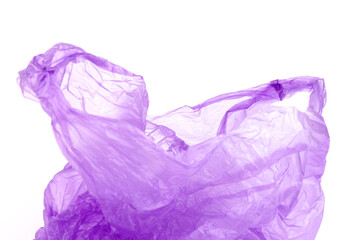 Closeup of used purple plastic disposable bag on white  background