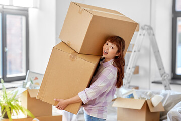 moving, people and real estate concept - happy smiling asian woman holding big boxes with stuff at...