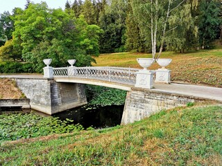 stone bridge over the pond Pavlovsk park summer day