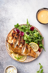 Pan roasted sea bass fish and green salad