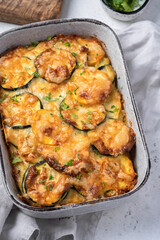 casserole with zucchini squash and cheese in baking dish