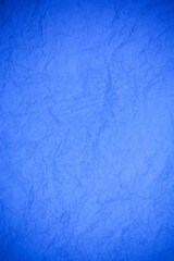 Crumpled vintage blue paper textured obsolete background.