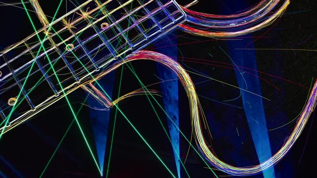 Wallpaper . Neon light guitar .Color neon background	
