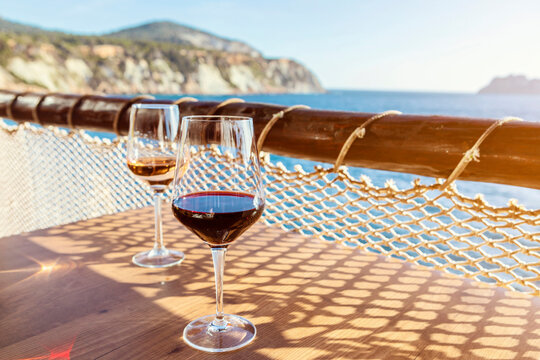 two wine glasses on a table in a restaurant on Ibiza near Es Vedr&agrave;