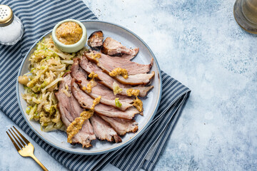Bavarian pork knuckle with sauerkraut with mustard