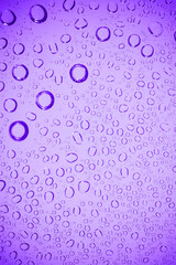 Water bubble on .purple glass.