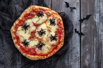 Ideas for Halloween. Margarita Pizza with olives spiders.