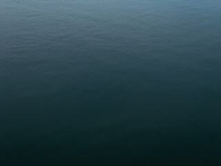 Dark deep blue Waves ripple claming Lake background