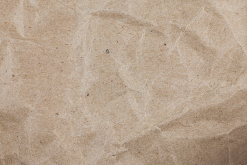 Textured crumpled packaging brown paper background.
