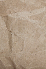 Textured crumpled packaging brown paper background.