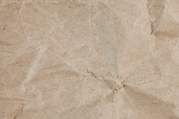 Obraz premium Textured crumpled packaging brown paper background.