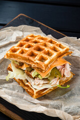 Restaurant Hot Starter Food Waffle Sandwich. Waffle Sandwich viennese waffles with ham, lettuce and pickled cucumber