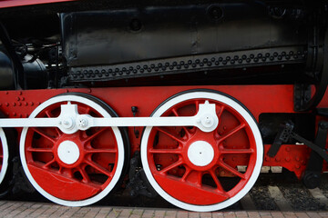 Fototapeta na wymiar old steam locomotive wheel