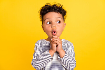 Photo portrait small boy amazed looking copyspace staring isolated vivid yellow color background