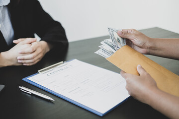 Businessmen make an agreement with the money proposed his partner to bribe in the company. The concept of bribery and corruption