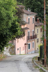 Fototapeta na wymiar Rural Village Street View with Houses and Trees in Central Italy