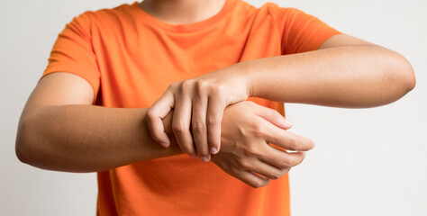 woman hand with numbness and pain in the wrist has pain and tingling in the nerve endings. which is a side effect of Guillain-Barre Syndrome after vaccination against COVID-19