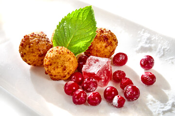 Doughnuts. Homemade curd balls with powdered sugar, isolated on white background. High resolution image.