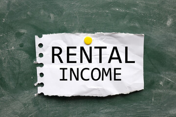 Rental Income. text on chalk board. black font