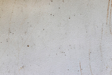 Abstract weathered texture stained old stucco light gray and aged paint white brick wall background. Brick wall may used as background.