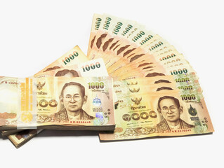 stack of Thai money banknotes baht on white background