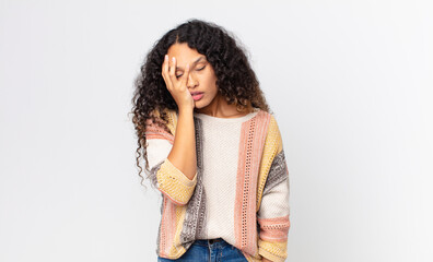 pretty hispanic woman feeling bored, frustrated and sleepy after a tiresome, dull and tedious task,...