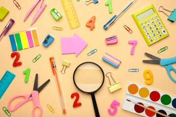 School supplies on beige background. Back to school concept.