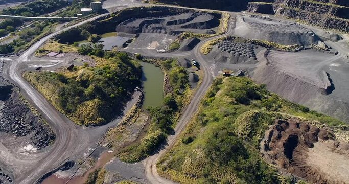Excavated basalt open pit mine in Australia &ndash; aerial top down view as 4k.
